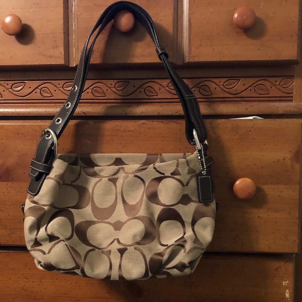 Brown signature Coach purse.